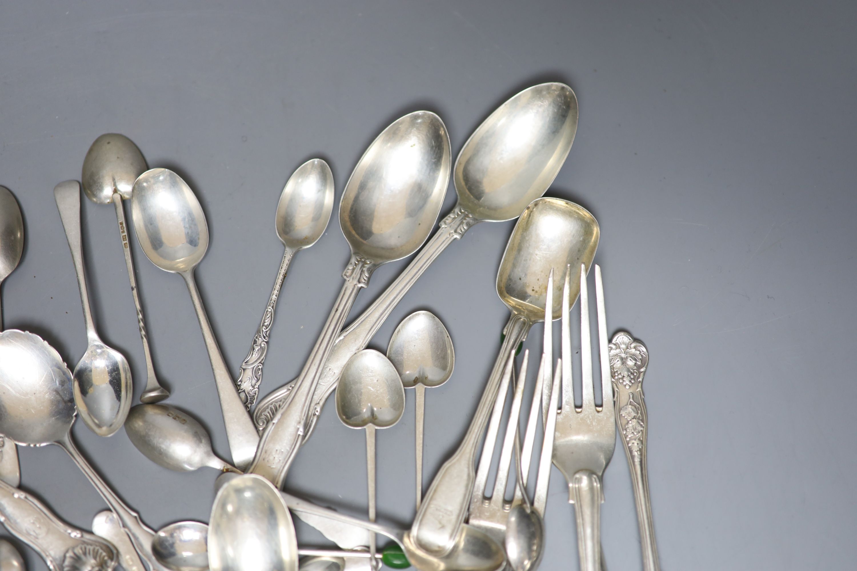 A quantity of assorted silver flatware including 19ct century table forks and dessert spoons and later teaspoons, coffee spoons etc